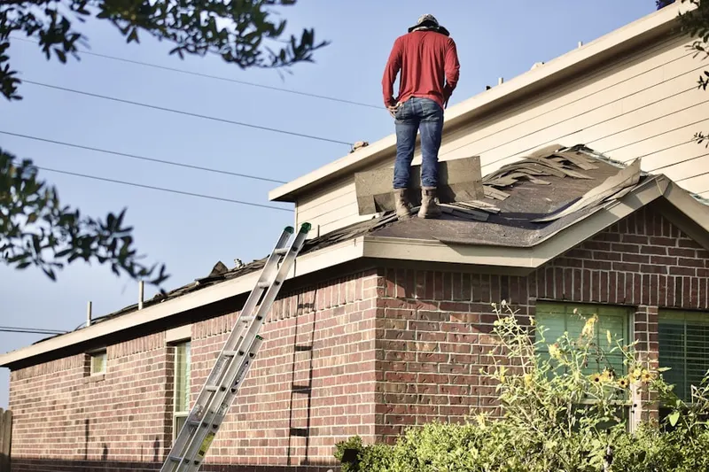Professional roofer working on a residential roof in State Fair